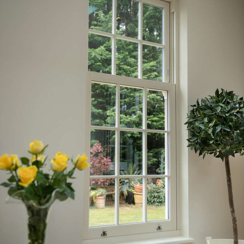 Energy efficient casement window from interior of property. Window is looking out into garden.